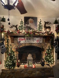 a fireplace decorated with christmas decorations and lights