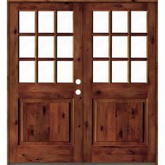 the double doors are made from wood and have glass panels on each side, along with two