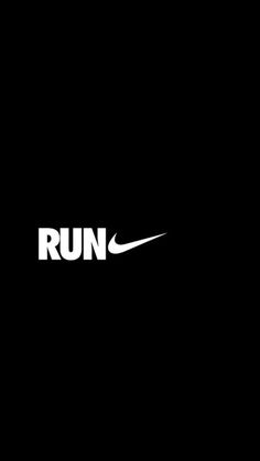 the nike run logo is shown in black and white on a dark background, as if it was taken from an airplane