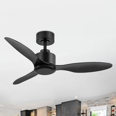 a black ceiling fan in a kitchen