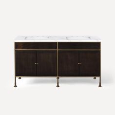 the sideboard with two sinks is shown in bronze and white marble top, along with brass legs