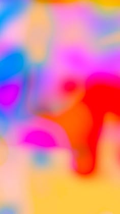 a blurry image of an orange and pink object