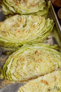 artichokes on a baking sheet ready to go into the oven