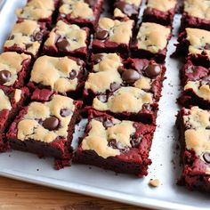 red velvet brownies with chocolate chips on a baking sheet, ready to be eaten