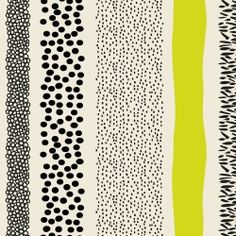 four different types of black and white patterns on a green striped wallpaper with polka dots