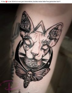 a cat with tattoos on it's leg is shown in this tattoo design by the artist