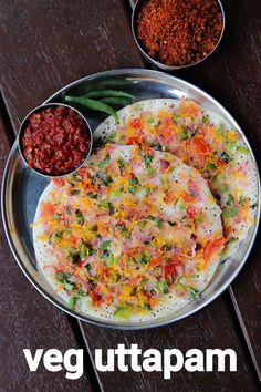 a plate with some food on it next to bowls of chili and seasoning powder