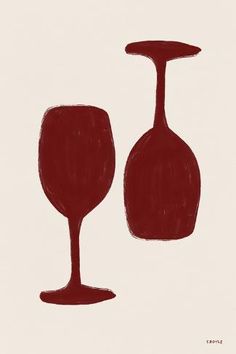 two red wine glasses sitting next to each other