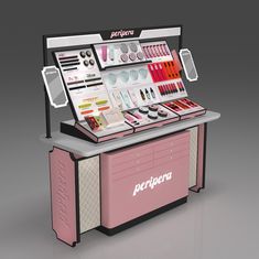 a pink and white display case with cosmetics on it's sides, in front of a gray background