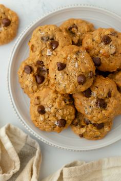 a plate full of chocolate chip cookies on top of a table