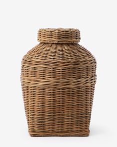 an empty wicker basket with lid on a white background