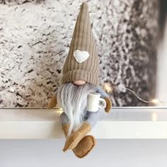 PRICES MAY VARY. Adorable Coffee Gnome Dolls - These cute coffee gnome dolls will please you with their kindness and charm. They want a place on your table, desk, fireplace, bookshelf, tiered tray, and more, creating a festive and welcoming home environment. Handmade and High-Quality Material - These handmade gnome figures are made of plush fabric and felt, soft, non-toxic, and neatly sewn. The coffee cups in their hands are made of felt cloth. The perfect gift - Scandinavian gnomes bring joy an Coffee Gnome, Swedish Tomte, Traditional Christmas Decorations, Doll Home, Led Christmas Lights, New Years Decorations, Coffee Lover Gifts, Christmas Gnome, Tiered Tray Decor