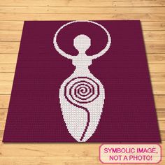 a rug with a woman's torso and spirals in the center on a wooden floor