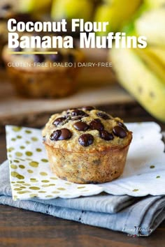 a muffin sitting on top of a napkin next to bananas