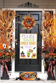 an image of a front door decorated for halloween