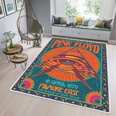 a pink floyd concert poster rug in a living room