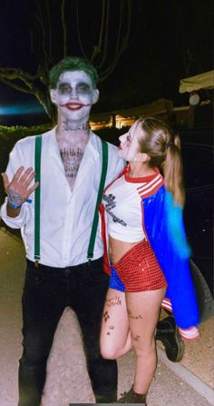 a man and woman dressed up as the joker and harley from batman comics standing next to each other