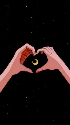 two hands making a heart shape with the moon and crescent above them in the night sky