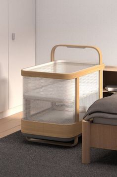 a bed with a wooden headboard and foot board next to a night stand on carpeted floor