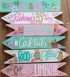 several wooden signs with different designs on them