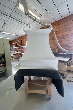 a large white stove top sitting inside of a kitchen