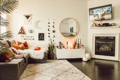 a living room filled with lots of furniture and decor