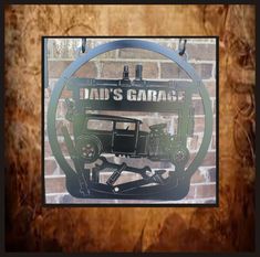 a metal sign that says dad's garage with an old car in the center