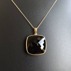 ITEM DESCRIPTION: >>The pendant is made from Solid 14K Yellow Gold. Gemstone used is absolutely natural and ethically sourced. >>Natural Black Onyx of cushion shape in bezel setting is studded on it with utmost precision. >>This is a minimalist design and is absolutely hassle-free and everyday jewelry. Gem: Black Onyx Gem size: 20x20 mm Gem weight: 19.71 carats Gold purity: 14K (58.33% approx.) Gold weight: 0.74 grams Gross weight: 4.68 grams The Gold purity is guaranteed and it comes with authe Black Onyx Pendant, Black Onyx Jewelry, Onyx Pendant, Gold Chains For Men, Onyx Jewelry, Onyx Necklace, Bezel Pendant, Jewelry Christmas, Unique Gemstones