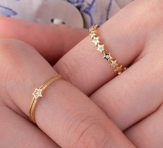 Our star rings are 14k solid gold. It has two styles; a multi-star band ring and a tiny star ring. Both two of the rings' stars are decorated with zircon stones. If you think of our gold star rings as a gift, they make happy your loved ones on their birthdays, mother's day, valentine's day, anniversaries, or graduations. 🎁 If you want, you can add a gift note for your loved ones. It arrives in a special jewelry gift box. ✨ We respond to your questions happily. Your question will be answered wit Star Jewelry Ring, Star Rings, Band Christmas, Zierlicher Ring, Solid Gold Ring, Tiny Star, Star Jewelry, Solid Gold Rings, Special Jewelry