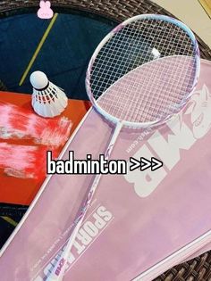 there is a badminton racket on top of a table next to other tennis accessories