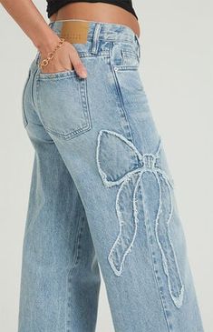 PacSun Casey Light Indigo Bow Low Rise Baggy Jeans | PacSun Bleach Wash Jeans, Cute Pattern Jeans, Jeans With Elastic Waistband, Clothes For Women Baggy, Big Baggy Clothes, Low Waisted Wide Leg Jeans, Embroidered Baggy Jeans, Hollister Low Rise Jeans, Cute Fits Jeans