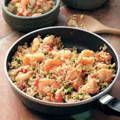 shrimp and rice in a skillet on a table