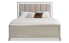 a bed with a white headboard and pillows on top of it, against a white background