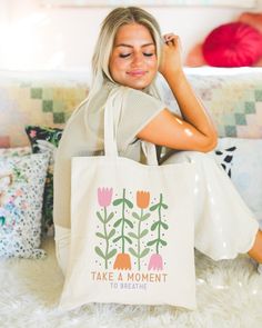 "This Retro Floral Tote makes the perfect bag for anyone looking to rock that simplistic boho style while also reminding themselves and those around them that its good to take a moment and breathe. Perfect as a gift or to treat yourself! The tote bag is made from sturdy, high-quality 100% cotton canvas, which makes it perfect for carrying books, groceries, or anything else you need to take with you. It measures approximately 15.75\"h x 15.25\"w with a handle length of 21.5\", with a roomy interior and comfortable handles that make it easy to carry. Please message us if you have any questions! Check out more of our unique designs in our shop!" Paint Canvas Bag, Tote Bag Painting Ideas Easy, Canvas Bag Painting, Cool Tote Bag Design, Paint Tote Bag, Bible Tote Bag, Diy Tote Bag Design, Painted Canvas Bags, Tote Bag Designs