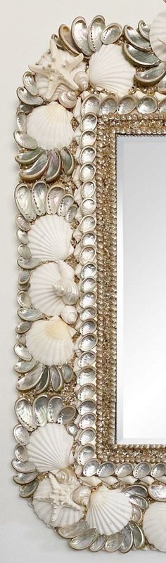 a mirror that has shells on it