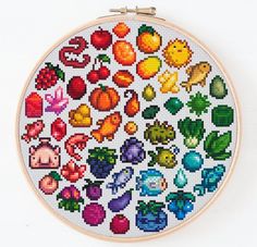 a cross - stitch pattern with fruits and vegetables on it, in the shape of a circle