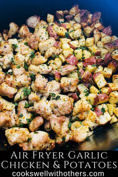 chicken and potatoes with herbs in a blue pot on the stove top text reads air fryer garlic chicken & potatoes