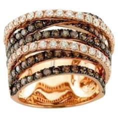 three tone gold ring set with brown and white diamonds