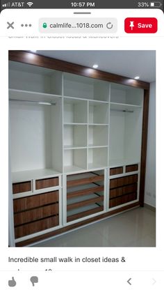 an image of a closet with white shelves and drawers on the bottom, and wood trimming