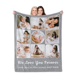 two women holding up a blanket with pictures of babies and their moms on it