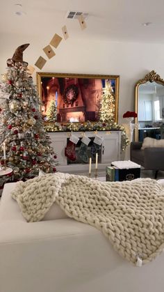 a living room filled with furniture and a christmas tree