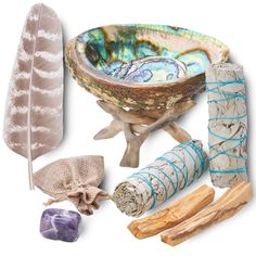 an assortment of decorative items including feathers, sticks and soap