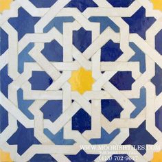 a blue and yellow tile with an intricate design