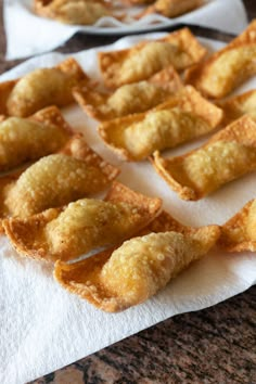 small pieces of food sitting on top of a white napkin