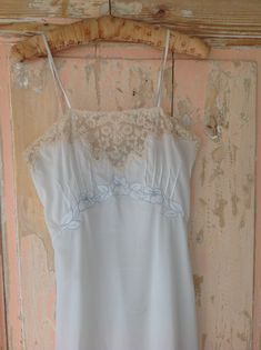 A beautiful 1930s slip dress. This one is very strong, and has beautiful beige lace. The flowers are made with special embroidery technics. High waist 75 cm   29.5" Bust 82 cm  32 1/3" length 113 cm in excellent condition Vintage Summer Slip Dress With Delicate Lace, Vintage Lace Slip Dress For Spring, Vintage Delicate Lace Slip Dress For Summer, Fitted Lace Patchwork Slip Dress For Weddings, Vintage Spring Wedding Slip Dress, Vintage Cream Lace Slip Dress, Vintage Camisole Slip Dress With Lace Trim, Vintage Camisole Slip Dress For Wedding, Vintage Lace Trim Slip Dress For Wedding