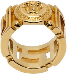 Band ring in gold-tone brass. Signature Greek key cutout throughout. · Signature Medusa at face · Logo engraved at inner band Supplier color: Gold Versace Clothes, Versace Ring, Versace Gold, Versace Jewelry, Versace Logo, Face Logo, Golden Ring, Luxury Products, 2024 Vision