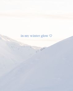 a man riding skis down the side of a snow covered slope with words written on it