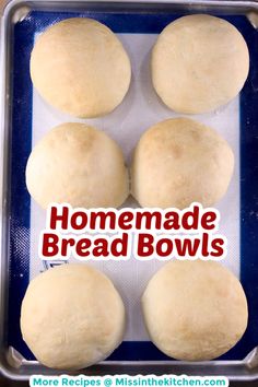 four homemade bread bowls sitting on top of a baking sheet with the words homemade bread bowls above them