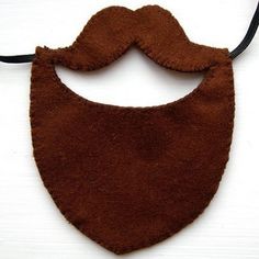 a brown felt bib hanging from a black cord