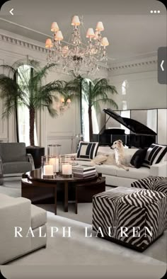 a living room filled with lots of furniture and a piano in the middle of it